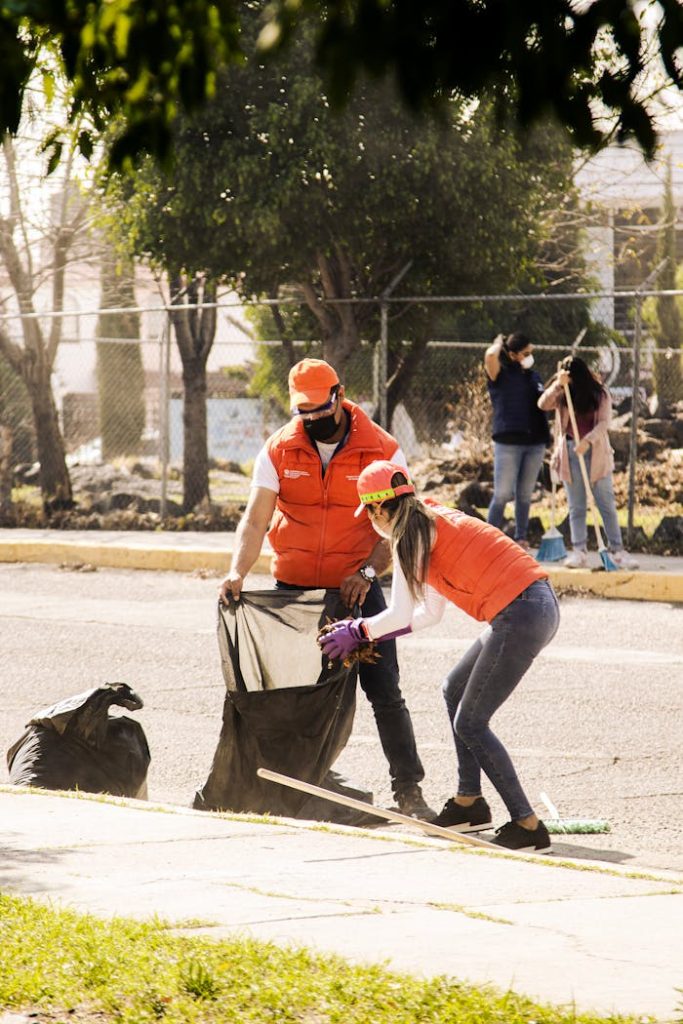 Volunteers in Puebla, Mexico collecting trash during a community clean-up event.